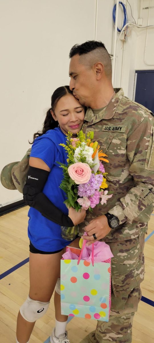 Abby is reunited with her father at her volleyball game. “I was filled with joy and [surprised] because I didn’t think it was going to happen anytime soon,” Abby said.