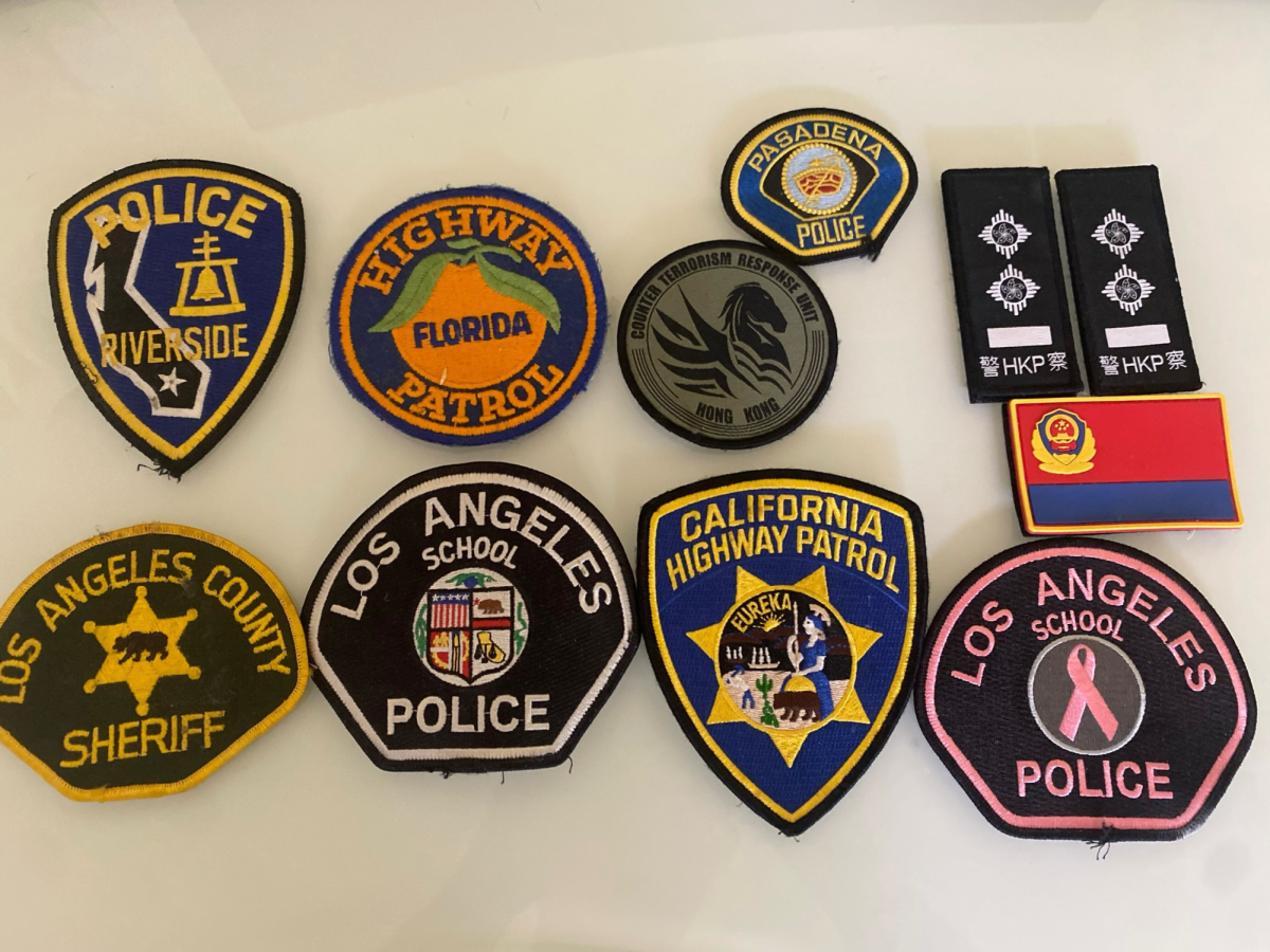 The police badges collected by Jin throughout his journey to becoming an officer.