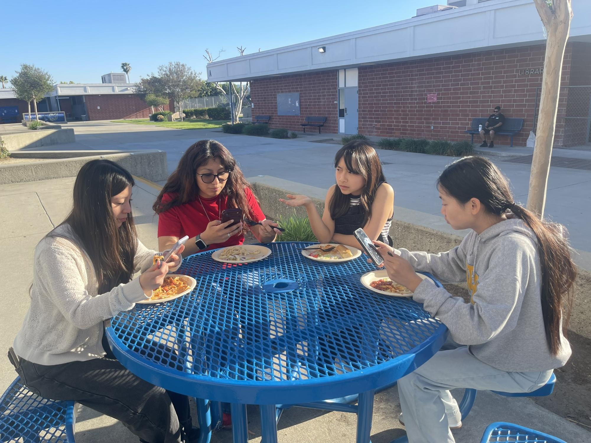 The Hoofprint students depict how even though friends sit together at lunch, they end up being on their phones and not talking to each other.