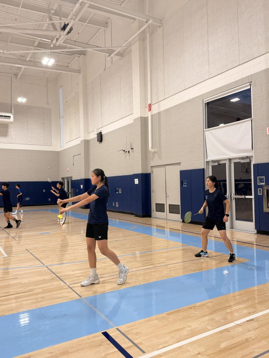 Freshman Felicia Ho and Victoria Zhu getting ready to serve their point (Photo Courtesy of Angie Hsu)
